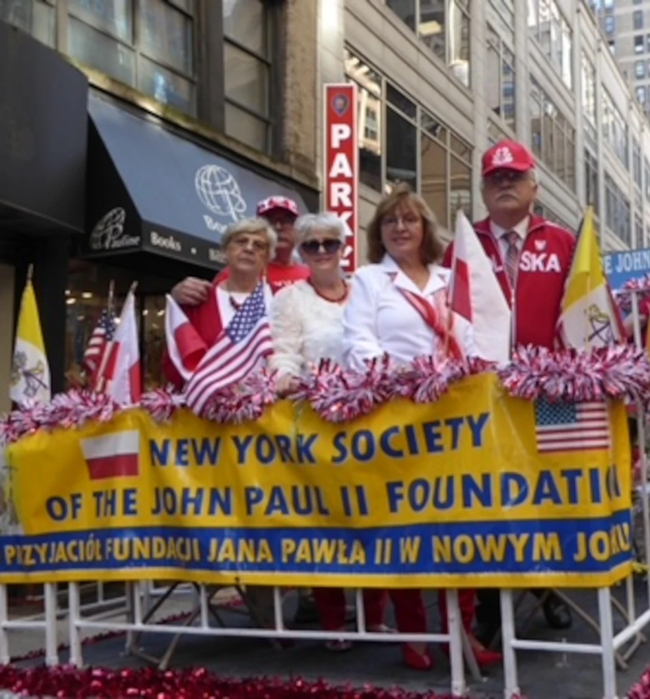 Marchers with Polish flags during the Pulaski Day Parade in New York City