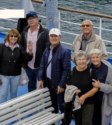 Members of foundation on a boat during a pilgramage