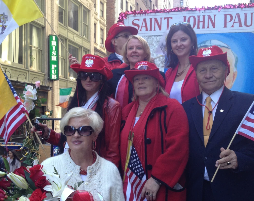 Foundation members marching with flags during the Pulaski Day Parade