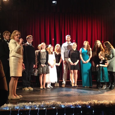 Singing group on stage of Sight & Sound Theater